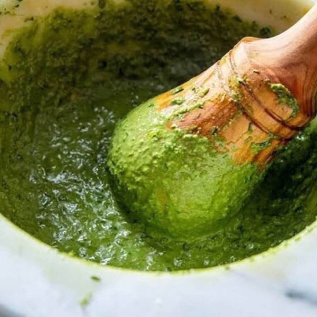 Making a green pesto sauce