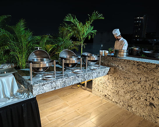 Live pasta station catering at a wedding event